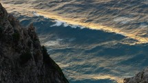 ocean wave motion at sunset