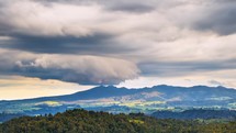 Dramatic stormy clouds sky motion fast over New Zealand wild mountains nature in summer evening landscape Time lapse

