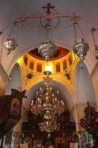 chandelier and incense burners in a cathedral 
