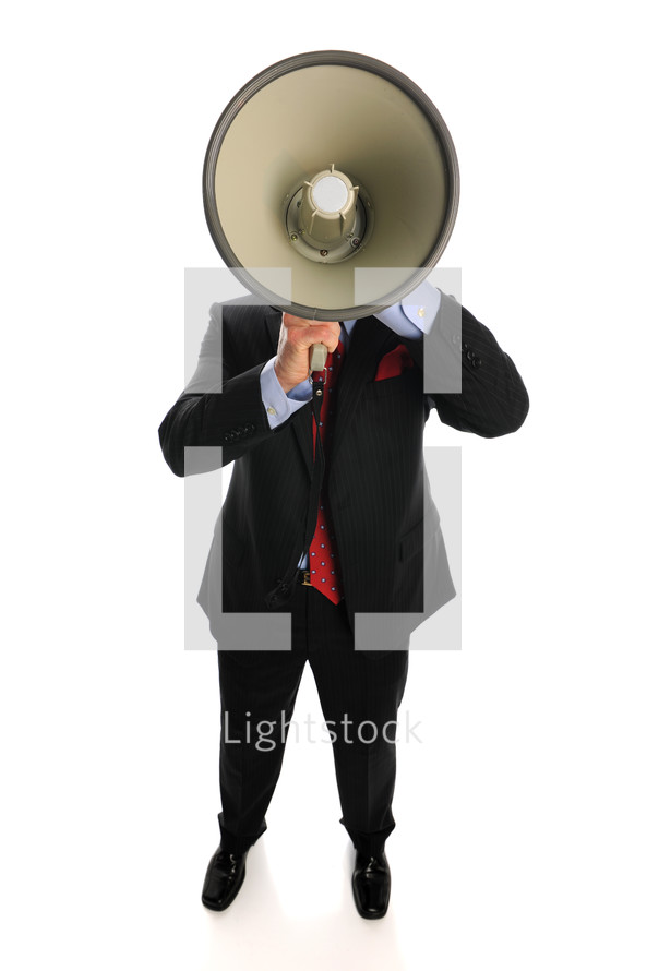 A man speaking through a  megaphone.