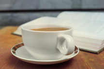 tea cup and open Bible 