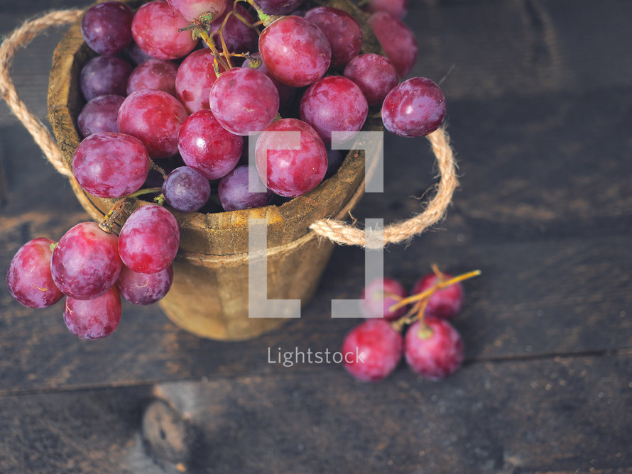 red grapes in a wooden basket 