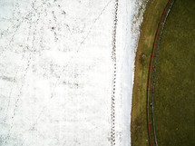 aerial view over rural farmland covered in snow 