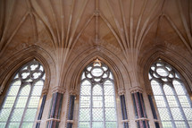 tall arched windows and ornate ceiling in a cathedral 