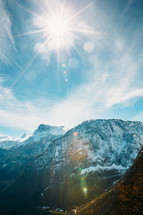 sunburst over snow capped mountains in Austria 