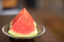 slices of watermelon on a plate 