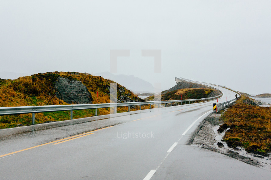 curve along a wet coastal highway 