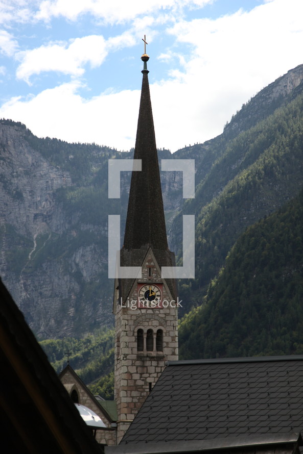 church steeple and mountains 