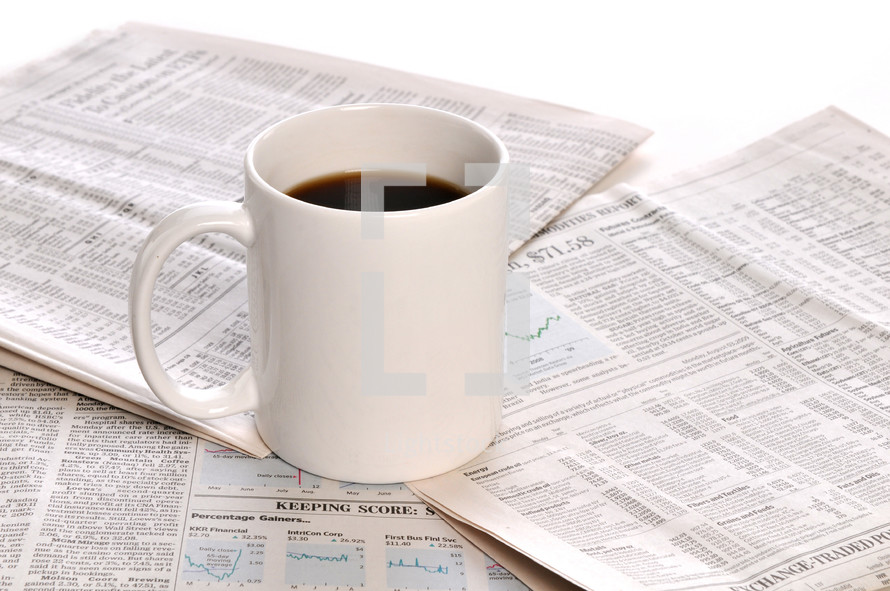 coffee mugs and newspapers 