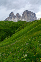 jagged mountain peaks and green mountainside 