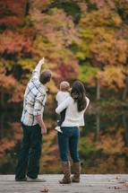 Family enjoying God's handywork. The father explaining the Fall colors.