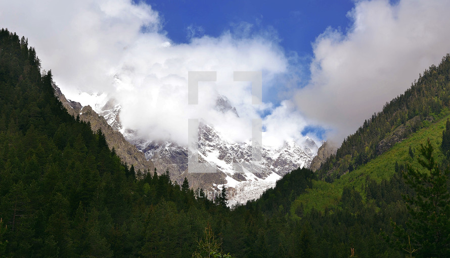 On a sunny day, view of a snowy winter Ushba, Schelda, and other Greater Caucasus mountains,  View from Svaneti, Mestia, Georgia.