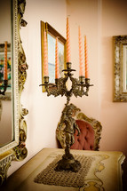 Brass candlestick in Baroque style in the dining room.