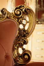 Detail of a decoration of a baroque style sofa.