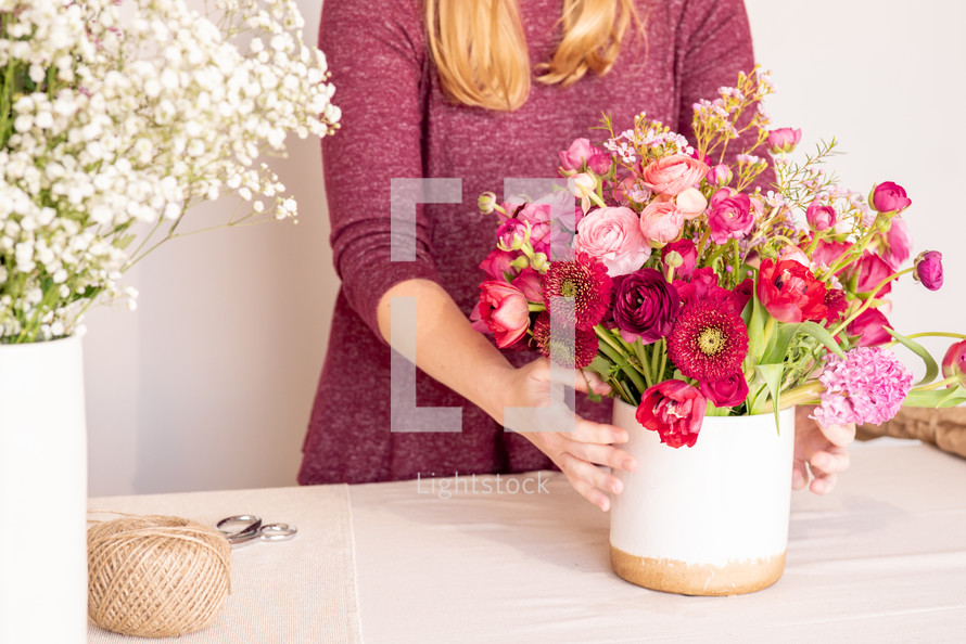 a mother holding a bouquet of flowers 
