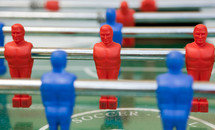 Foosball table with red and blue players