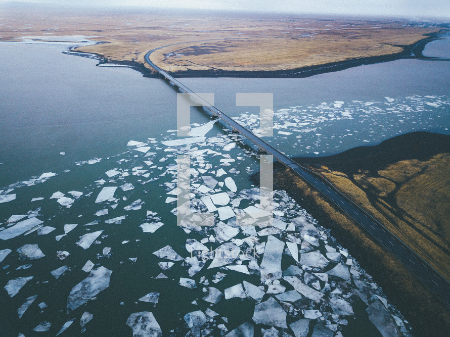 a bridge over an icy lake 