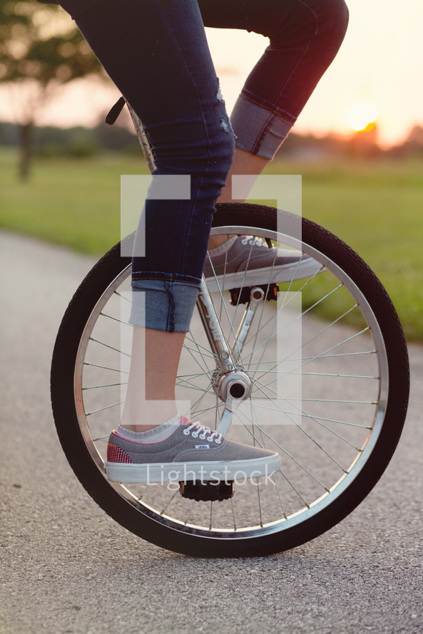 woman riding a unicycle 