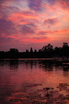 pink and purple sky over a pond in Southeast Asia 