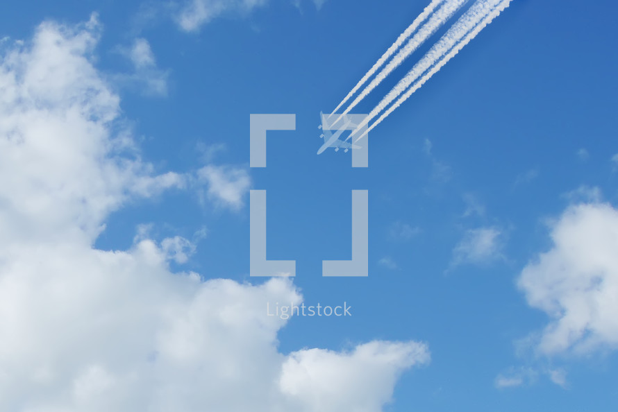 airplane with plane contrails 