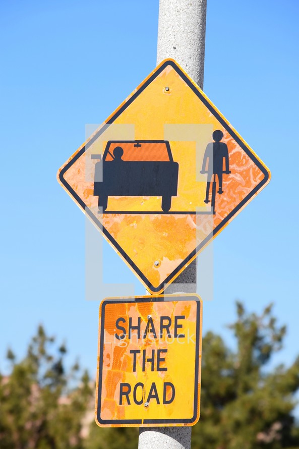 Share the road street sign 
