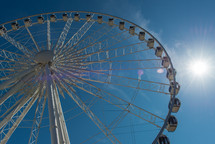 ferris wheel in a blue sky 
