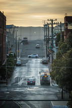 wet city street on a hill 