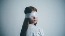 blindfolded woman 