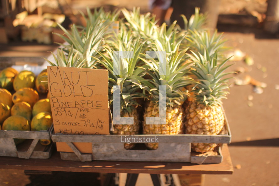 pineapples at a farmers market 