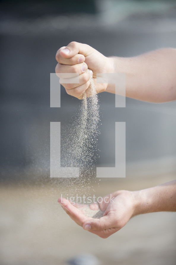 filtering sand through your hands