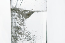 water being poured into a glass 