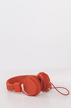red headphones on a white background 