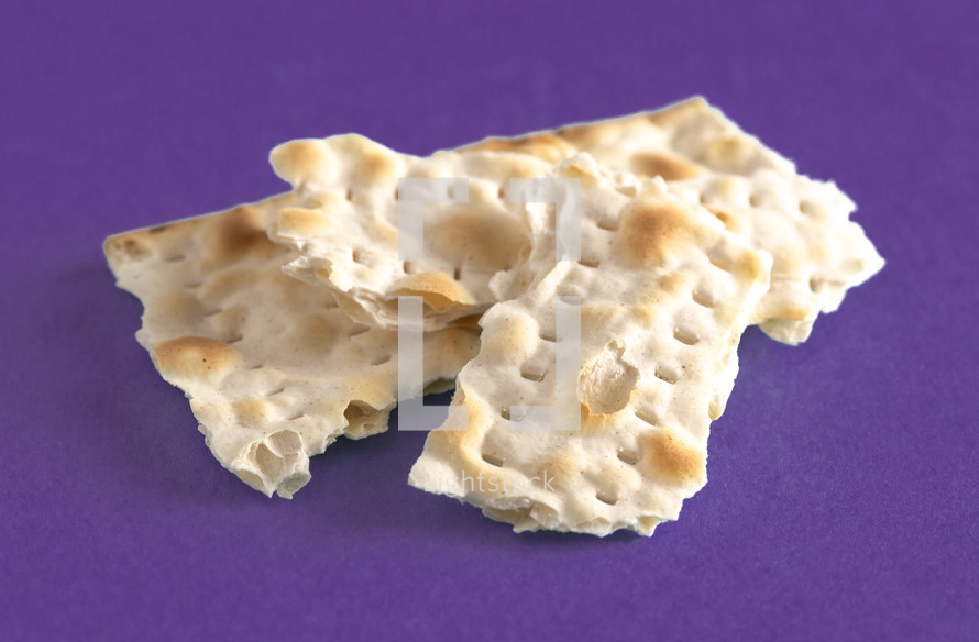 unleavened bread on a purple background 