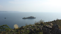 view of a small island from a cliff 