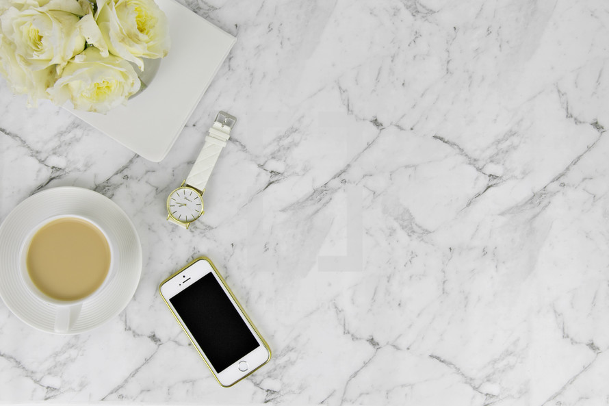Carrara marble, iPhone, scissors, paperclips, gold, white, coffee cup, roses, watch, journal, copy space 