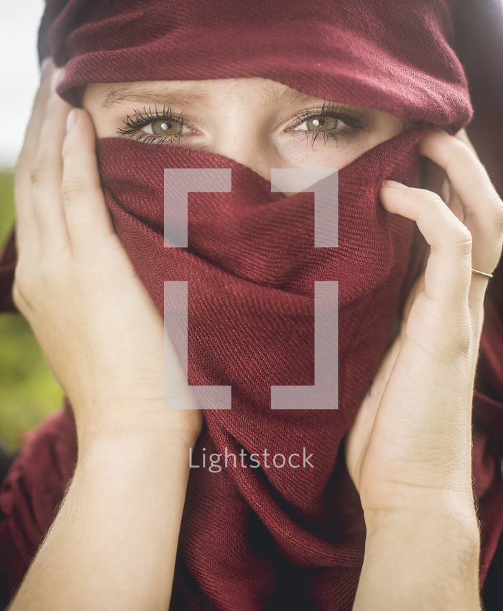 woman behind a scarf 