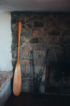 oar beside a fireplace 