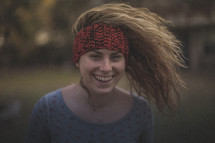 A girl with wild hair and a headband