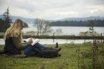a woman studying scripture outdoors 