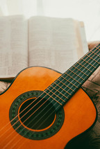 open Bible and acoustic guitar 