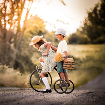 kids on a vintage tricycle 