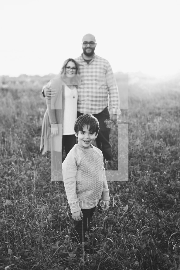 family portrait in a field of tall grasses 