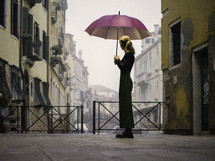 Woman with purple umbrella in Venice