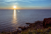 sunburst reflecting over ocean water 