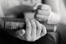 person holding a Bible 