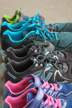row of tennis shoes of a family 