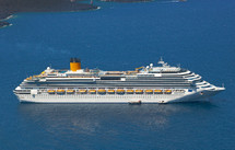 cruise ship near volcano on island of Santorini, Greece