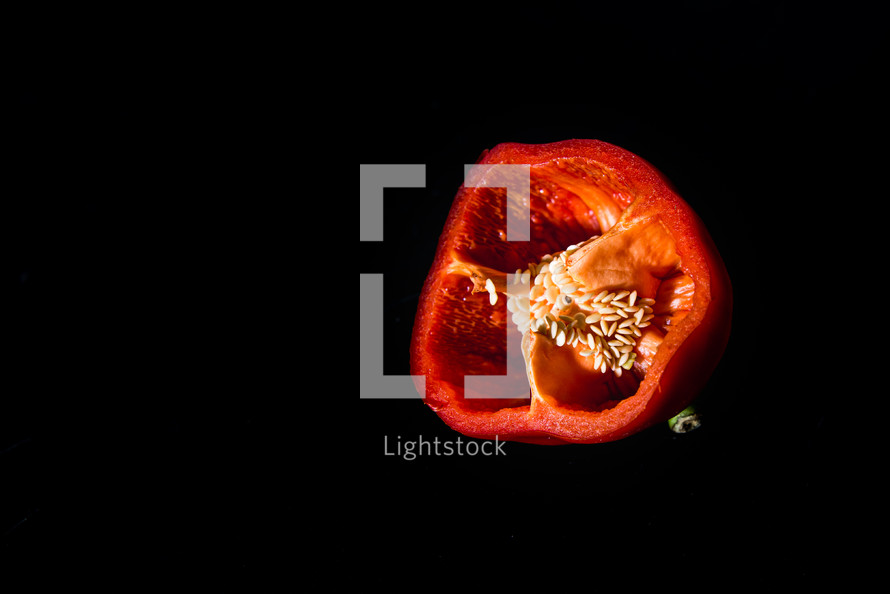 red pepper on a black background 