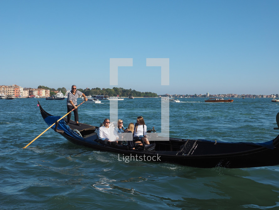 VENICE, ITALY - CIRCA SEPTEMBER 2016: Gondola traditional flat bottomed rowing boat in the Venetian lagoon
