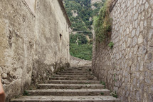 steps through narrow alley in Italy